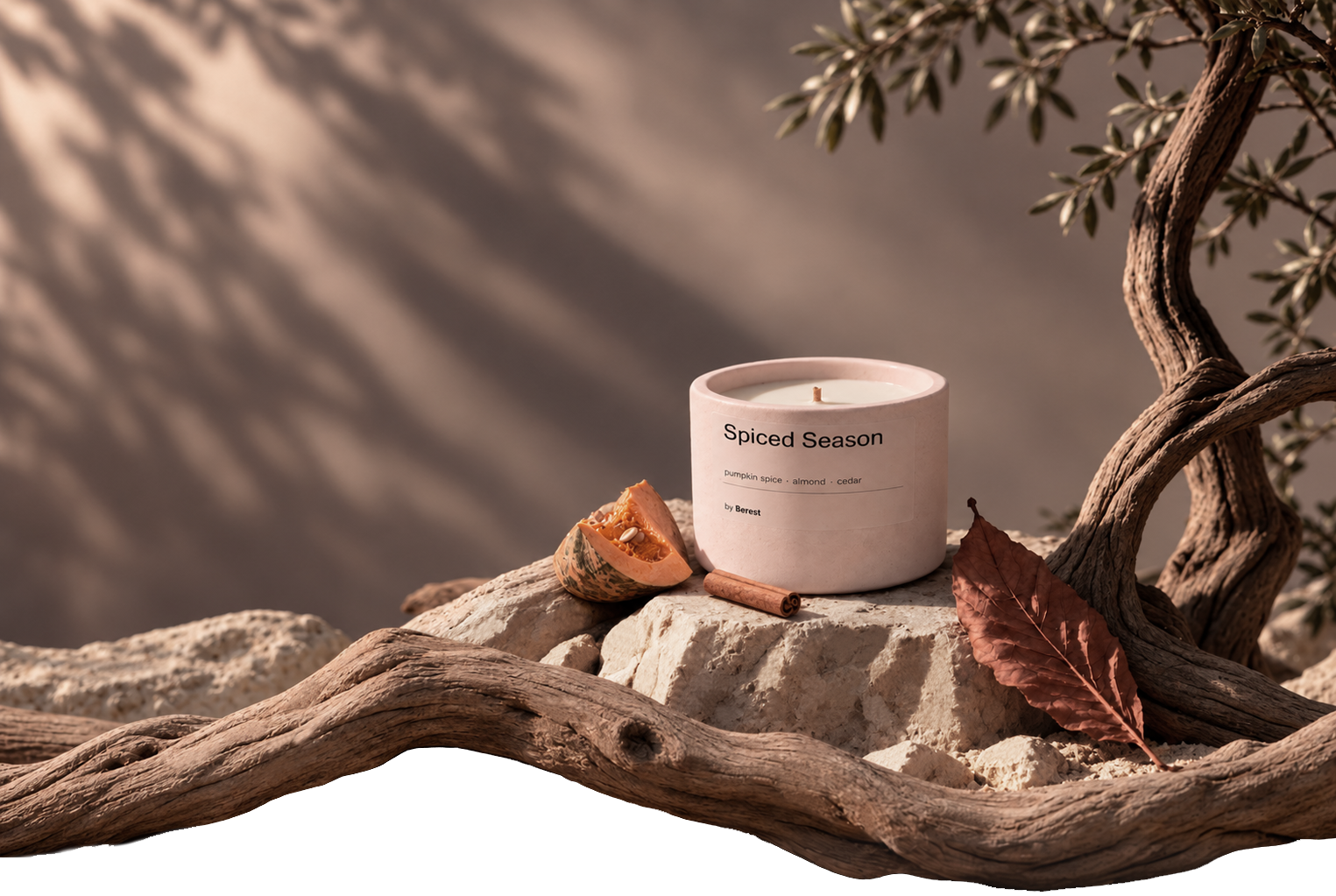 Spiced Season candle on limestone, surrounded by autumn leaves, pumpkin and driftwood